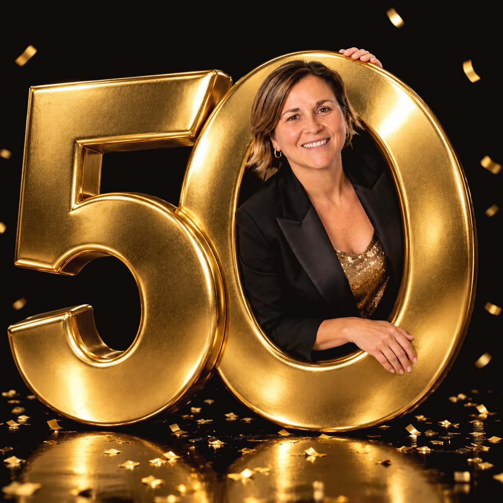 Emily, smiling, leaning out through a giant gold 50